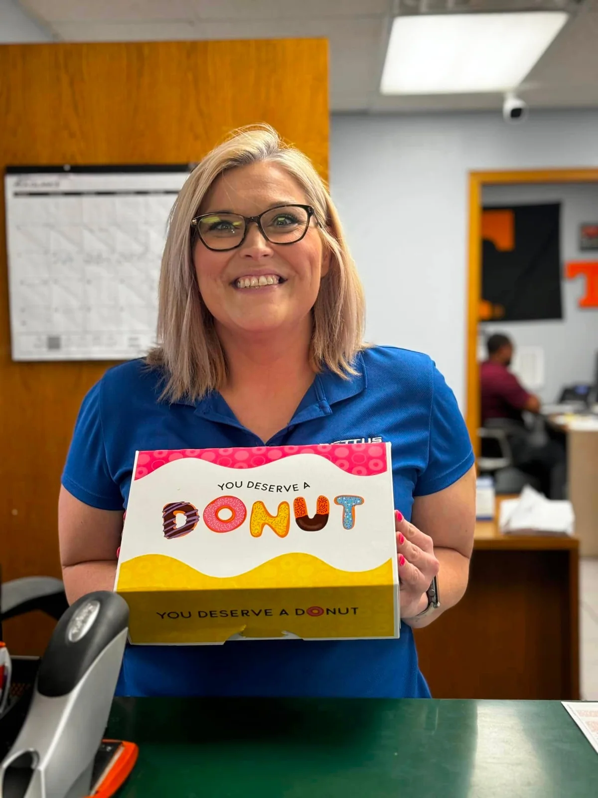 Pettus team member sharing a box of donuts