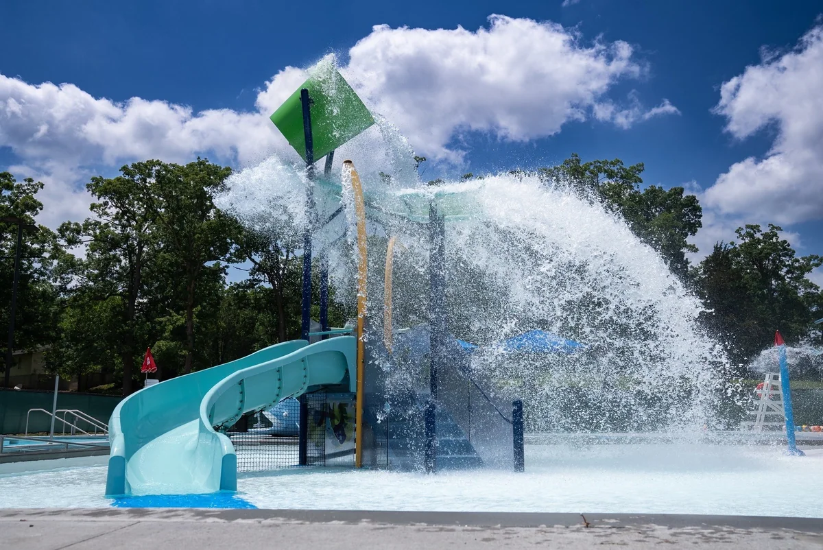 Families enjoying the splash features at The Reef