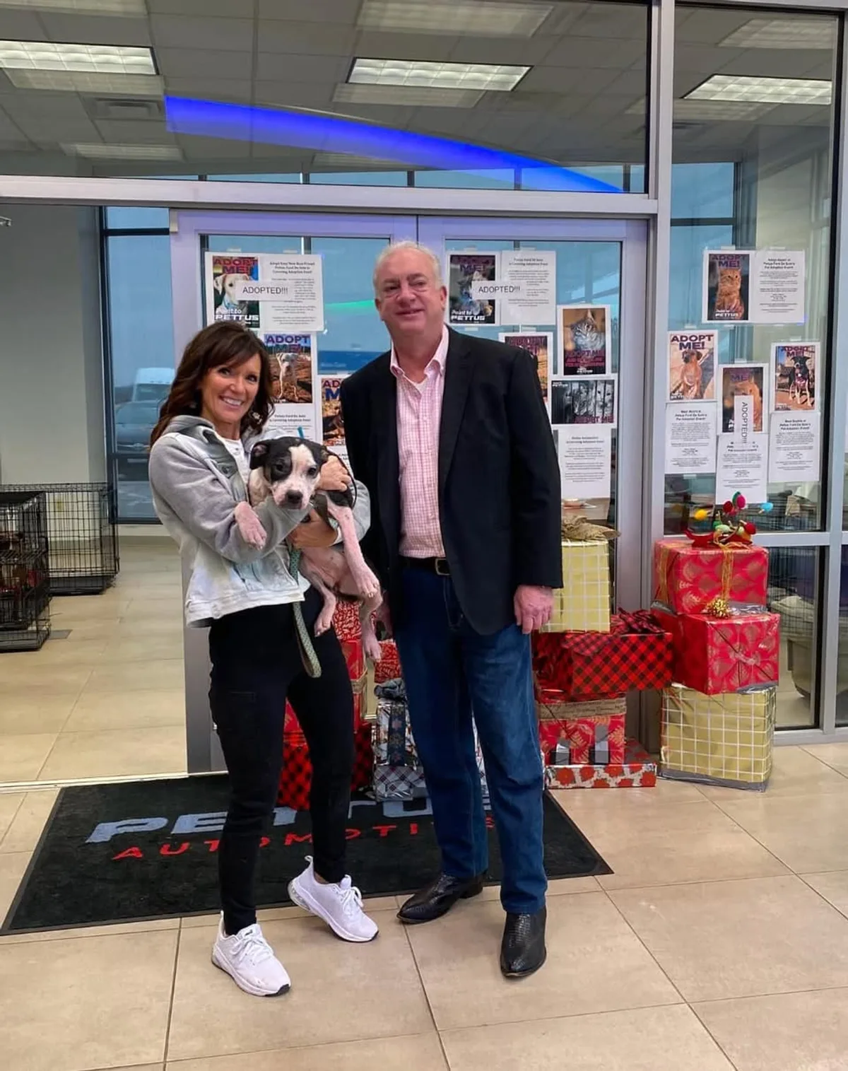 Pettus and City of De Soto Kennel supporters with an adoptable puppy at the dealership