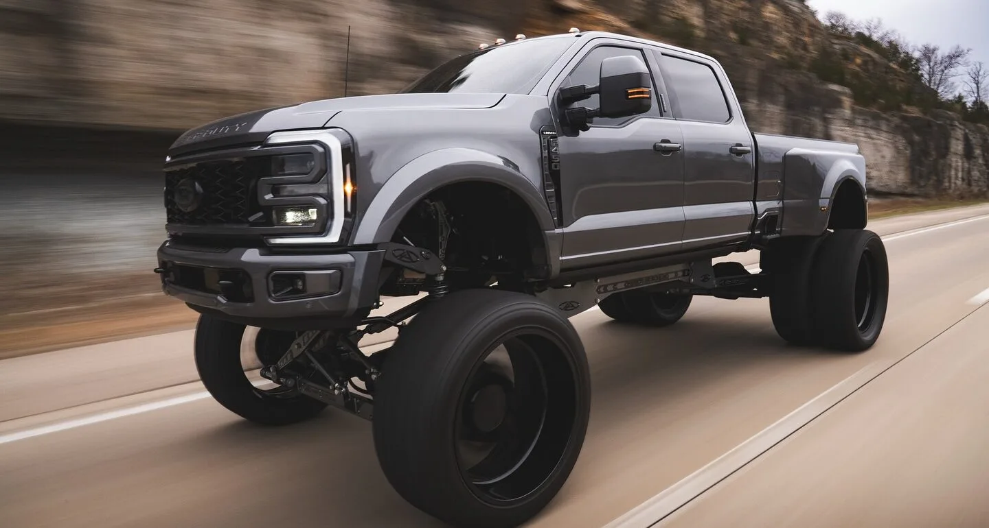 Custom AnyLevel Ford F-450 build by APG Customs driving on the road